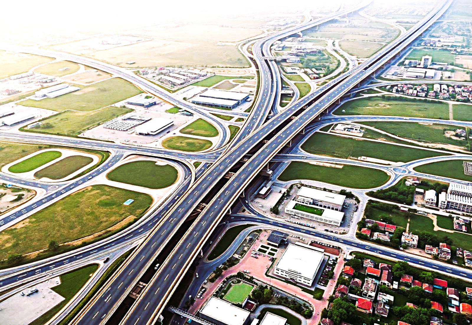 Aerial view of expressway interchange and planned plotted development near MET City